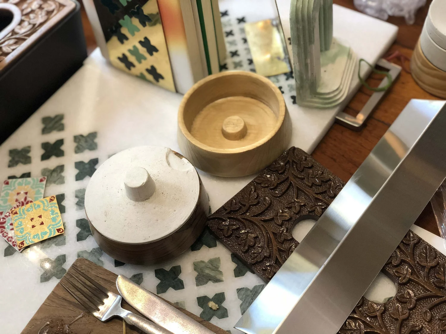 BFT Home products detail showcasing ceramic pieces with engraved patterns on patterned surface