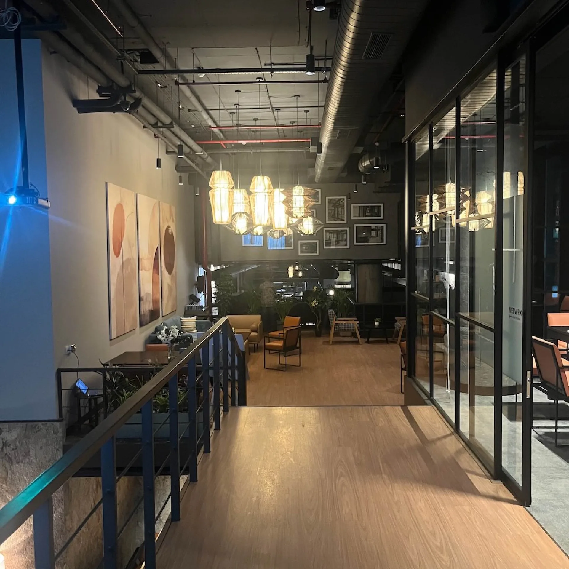District 150 - Modern office interior with exposed ceiling and industrial design elements