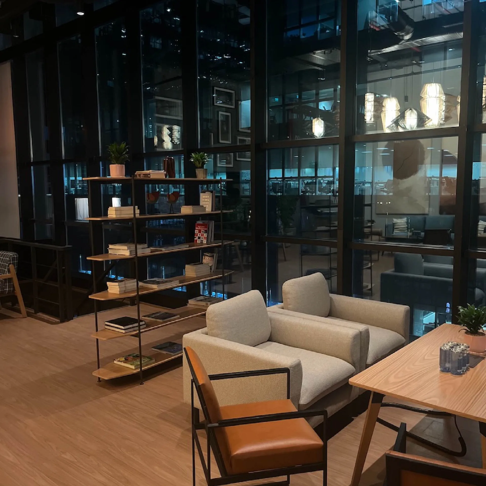 District 150 - Contemporary workspace with comfortable seating and glass partitions