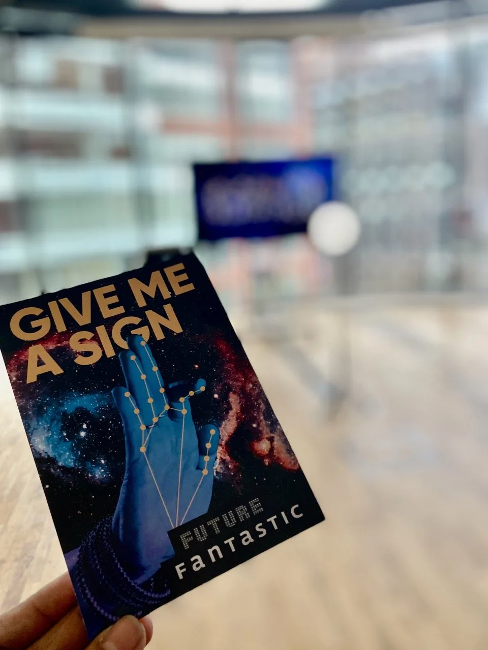 Give Me a Sign - Exhibition card with gestural hand constellation logo