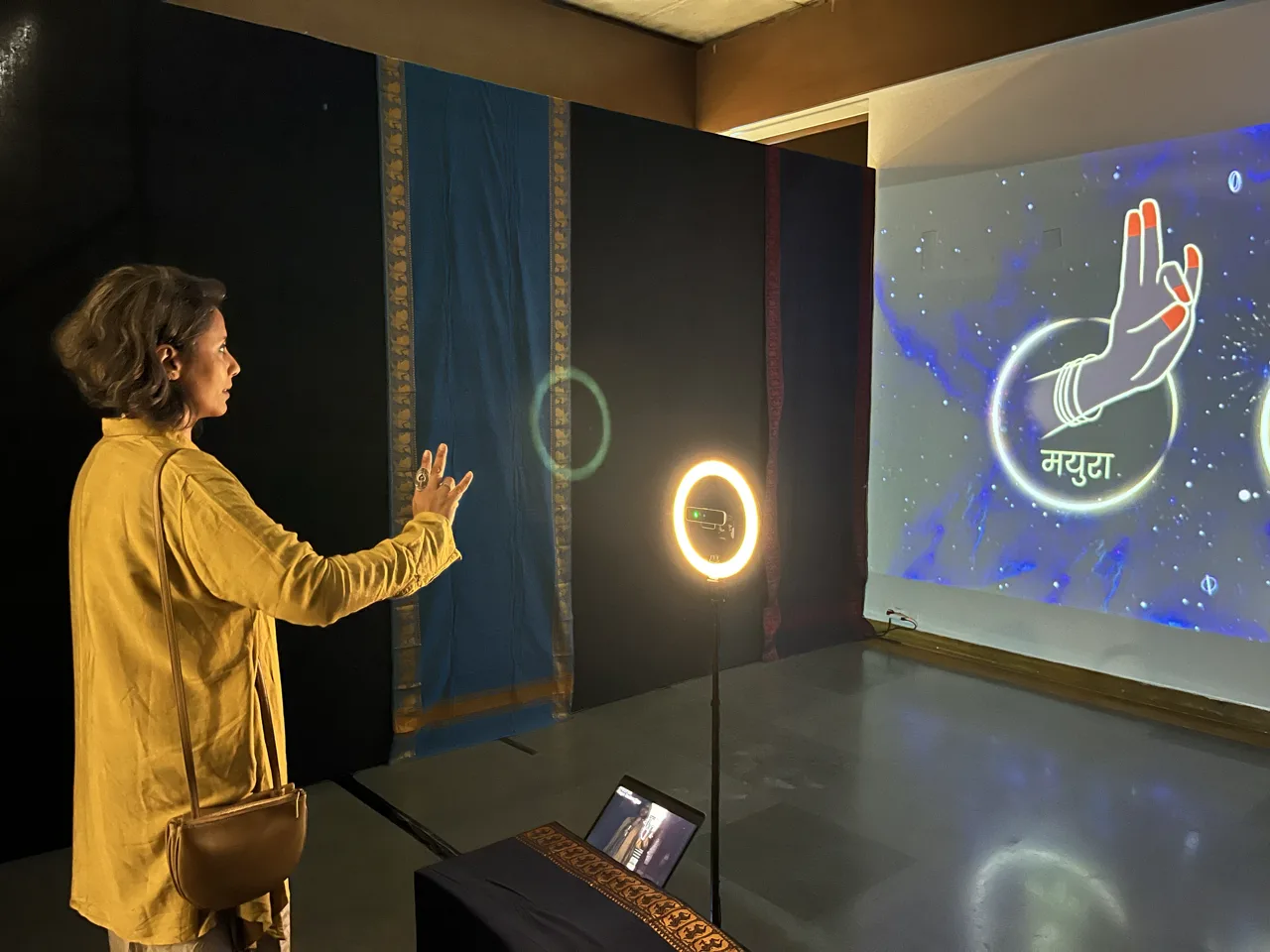 Give Me a Sign - Participant performing gesture with illuminated hand interface