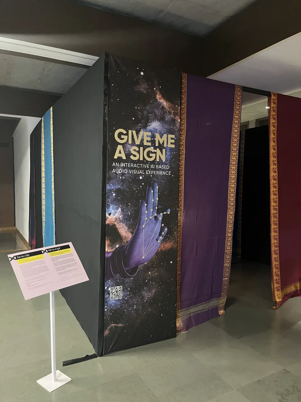 Give Me a Sign - Installation entrance panel with branding and textile drapes