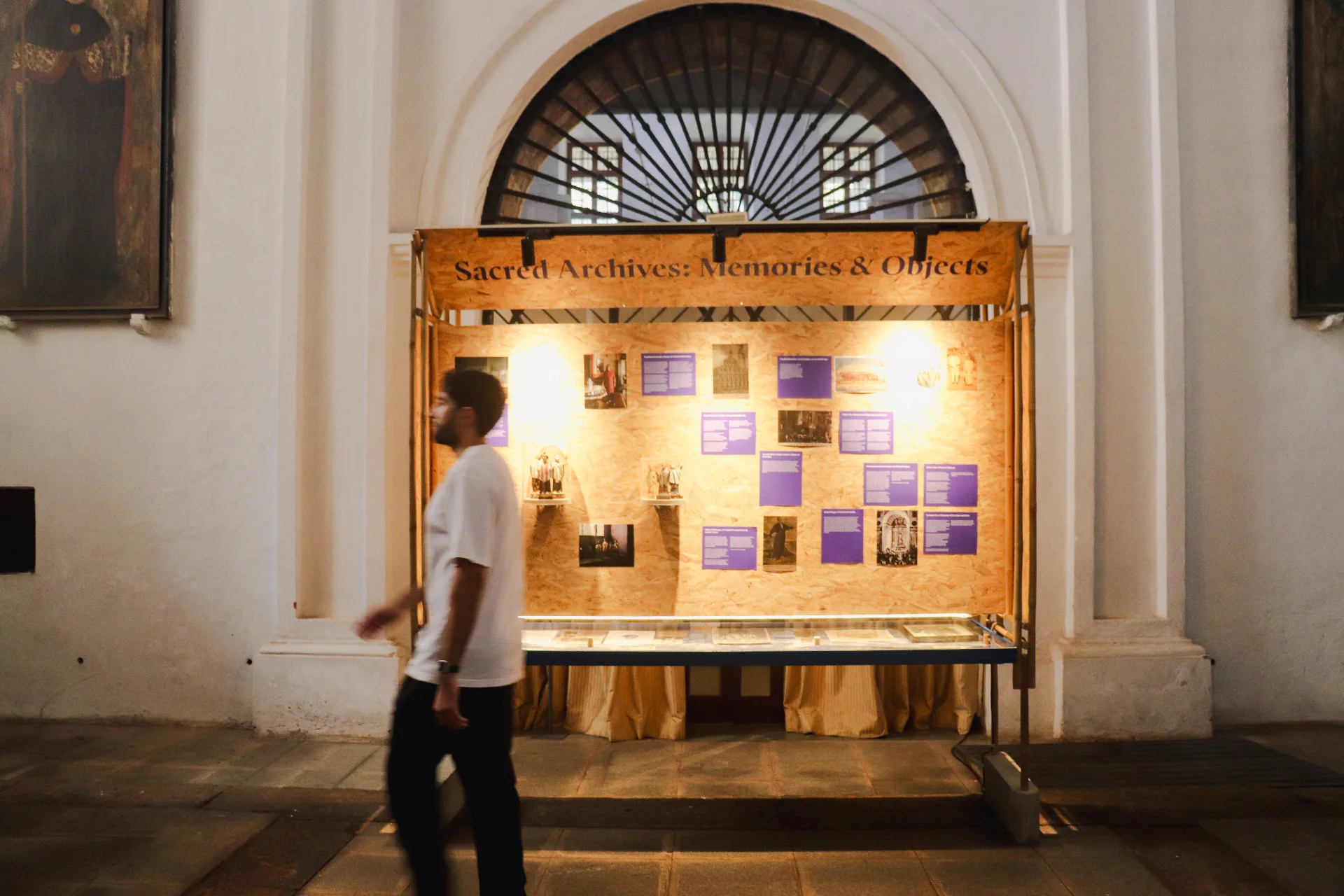 GOA FAMILIA - Wooden exhibition pod showcasing Sacred Archives with photographs and memorabilia