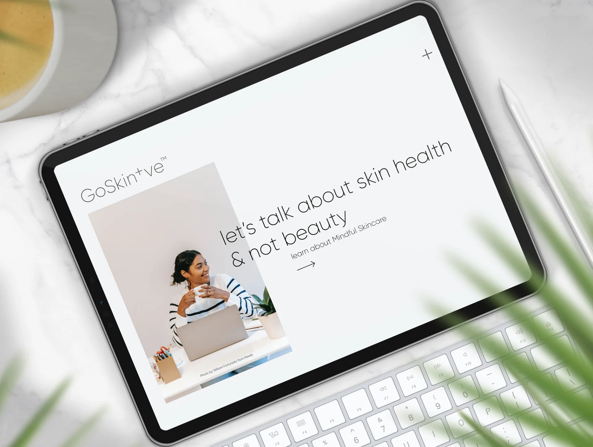 GoSkin+ve website mockup on tablet showing skin health focus over beauty with mindful skincare approach