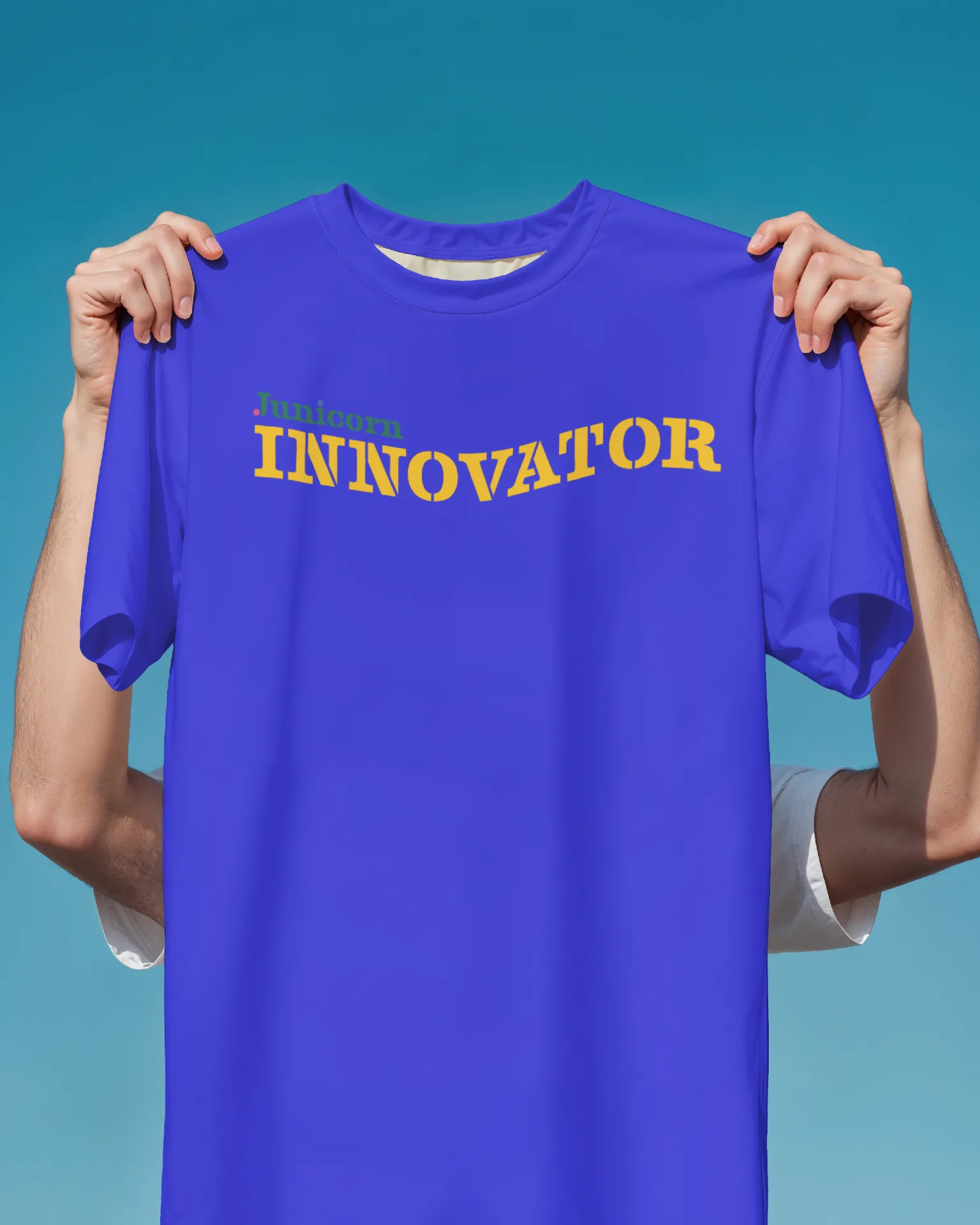 JUNICORN - Blue t-shirt mockup with Junicorn Innovator branding in yellow typography
