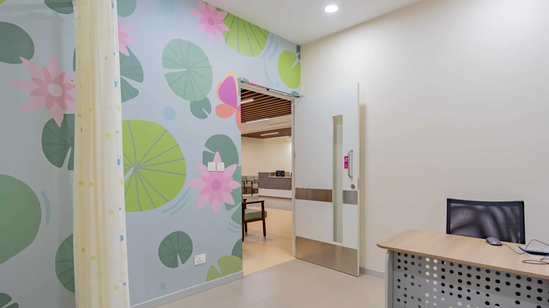 Kauvery Hospital - Lotus pond mural around a consulting room doorway