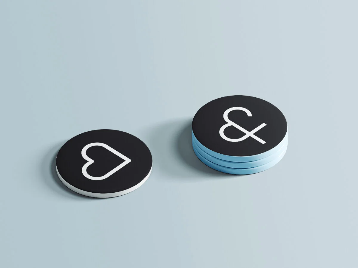 Maw & Paw branding pin buttons with heart and ampersand symbols