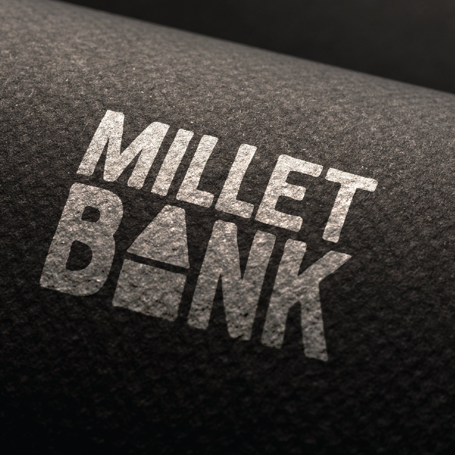 Millet Bank - Logo stamped on textured ground surface