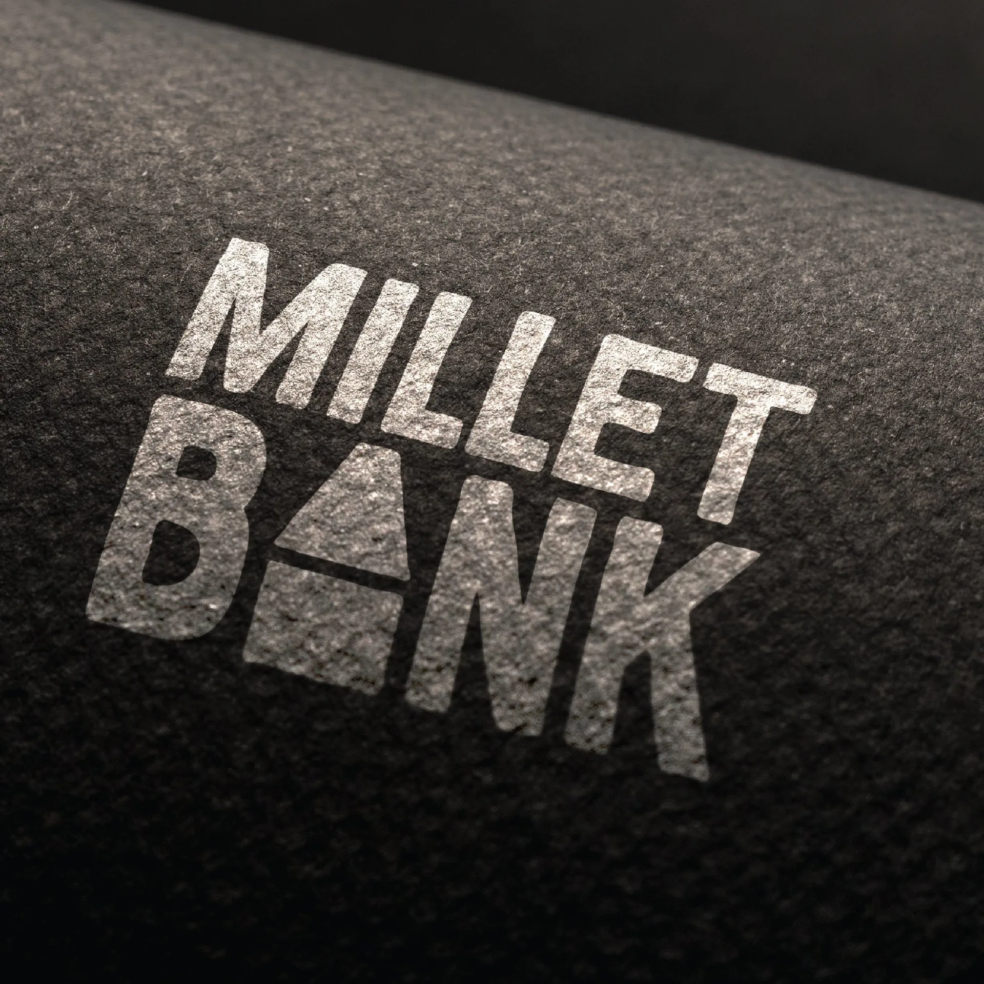Millet Bank - Logo stamped on textured ground surface