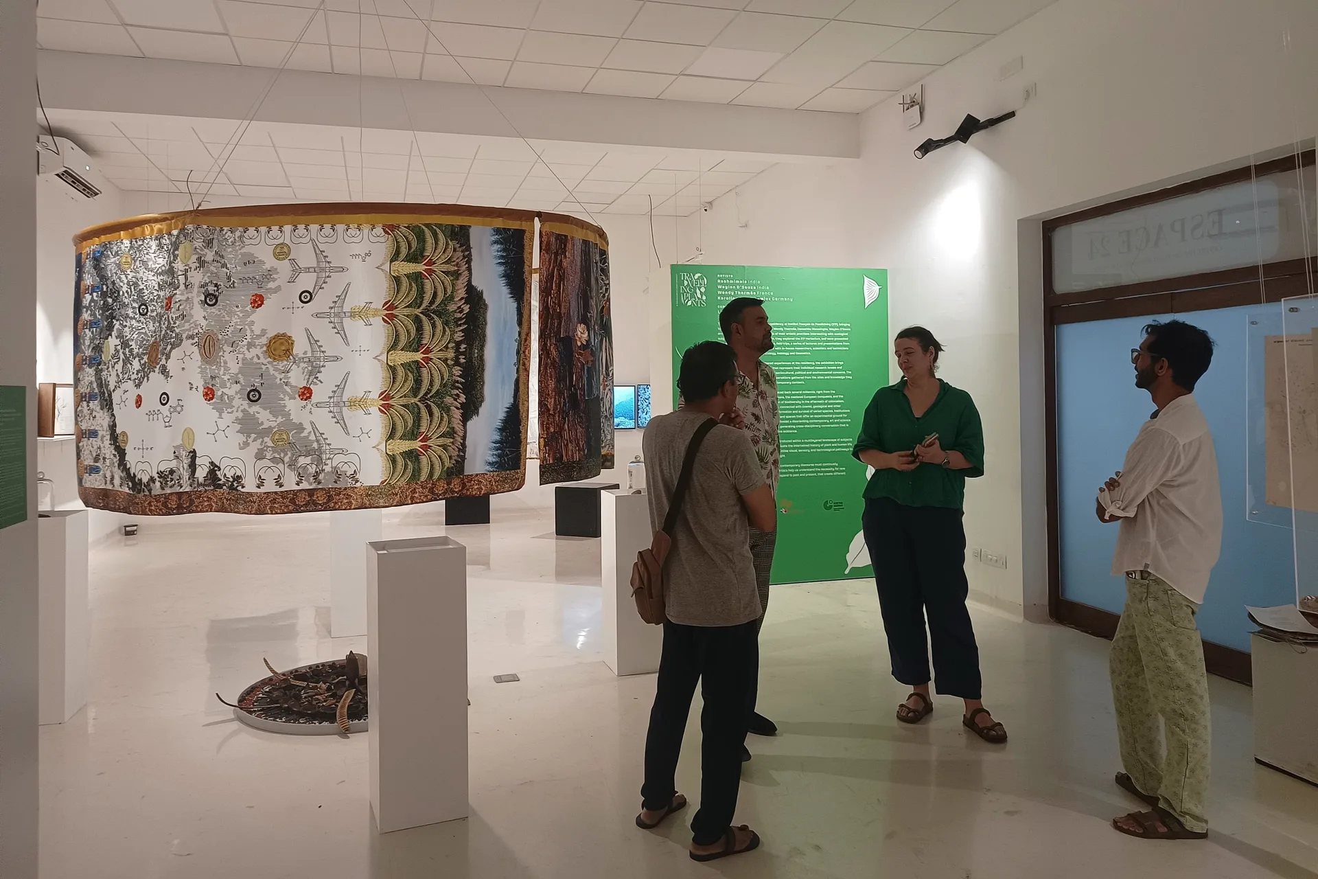 Travelling Plants - Gallery exhibition space showing visitors exploring botanical art installations and displays