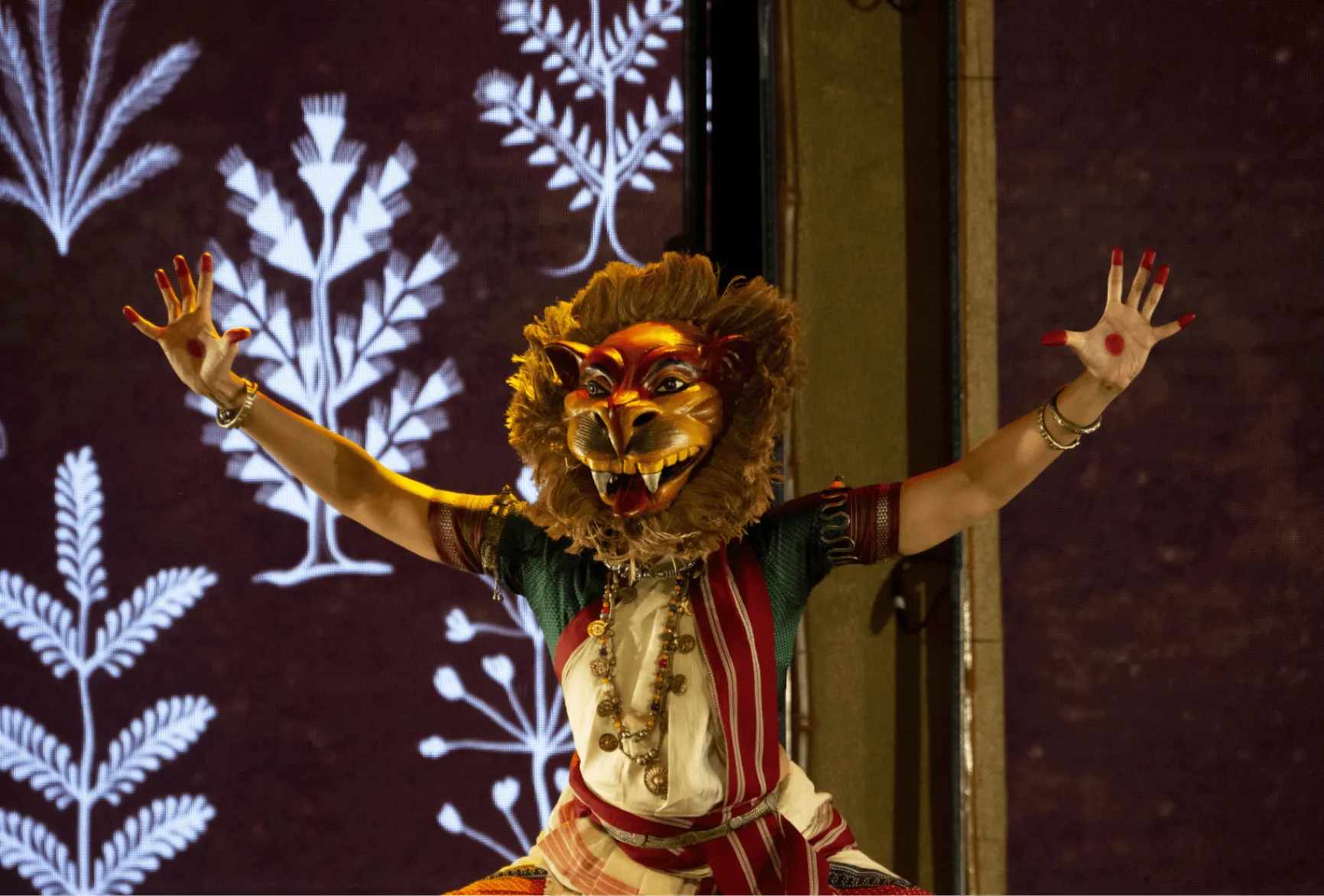 When Walls Dance - Performer with lion mask and botanical projections
