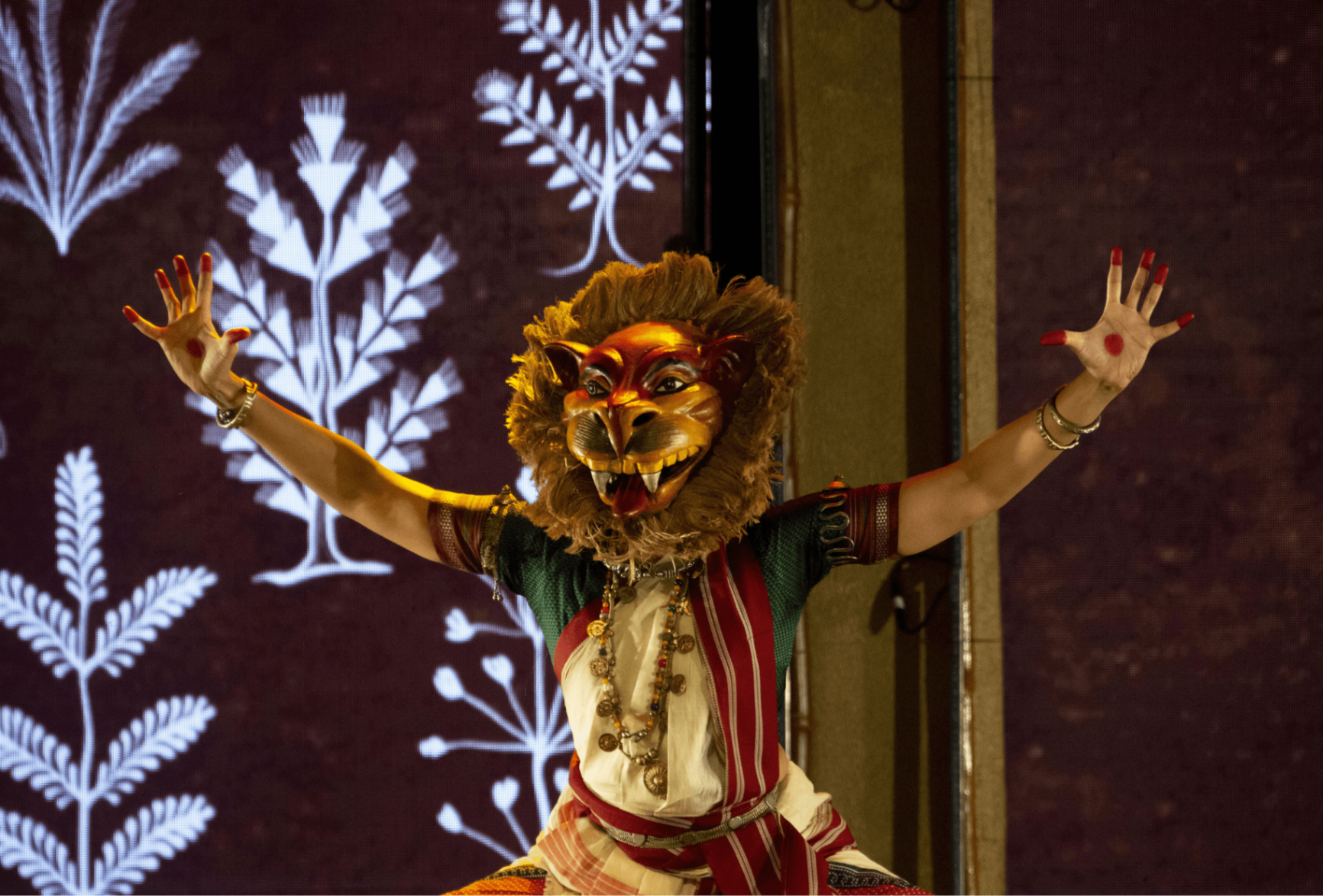 When Walls Dance - Performer with lion mask and botanical projections
